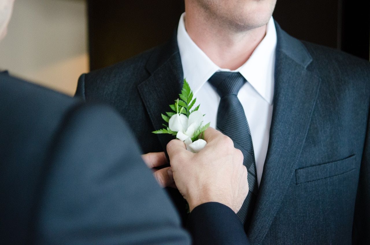 Luxury Wedding - Pinning Flower On Groom